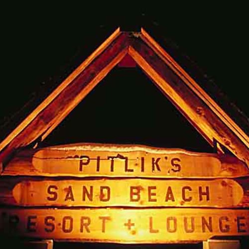 Pitlik's Sand Beach Resort and Lounge sign.