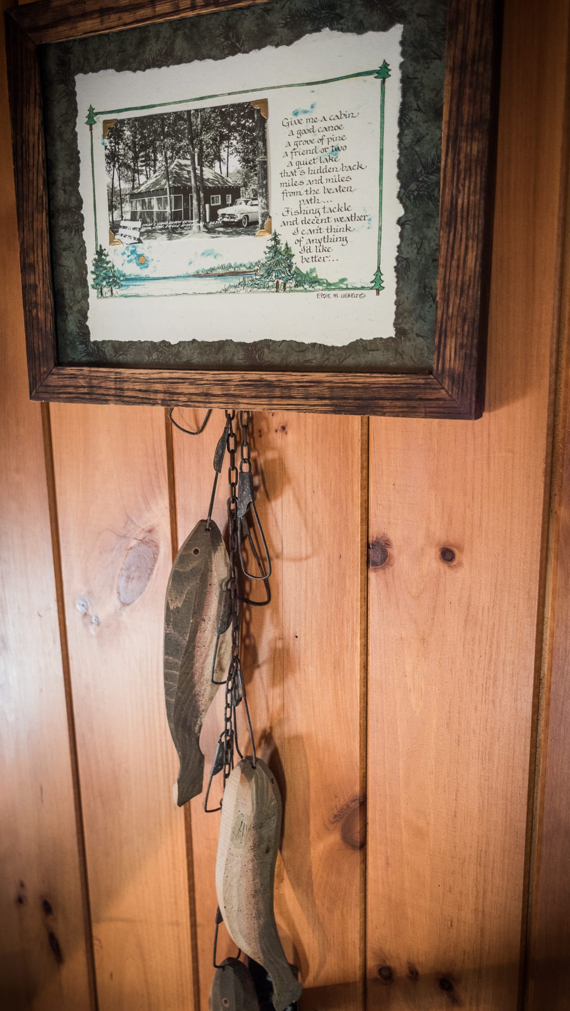 Lakeview cabin framed picture and hanging wooden fish