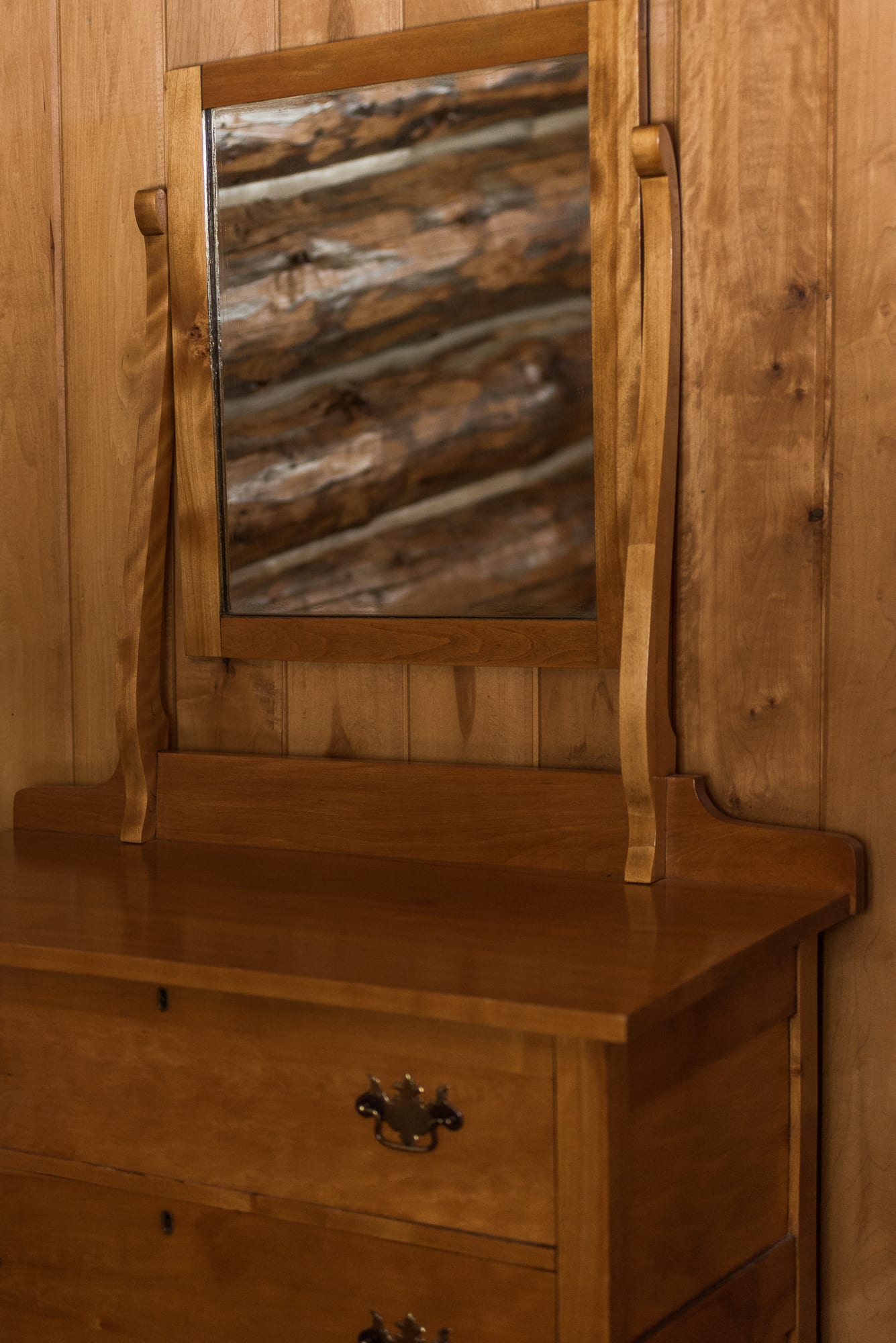 Cabin dresser and mirror.