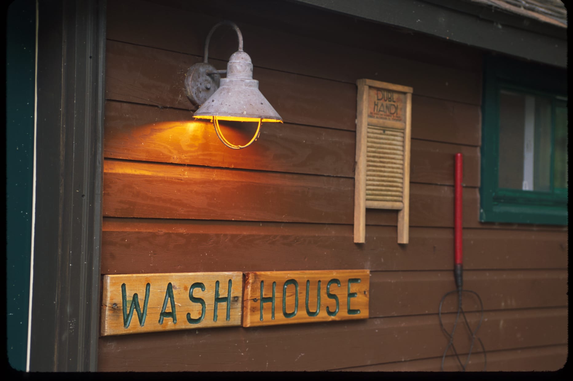 Washhouse exterior with sign.